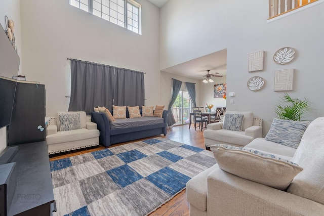 2012 Juniper Ct Unit 2012, Glendale Heights, IL 60139 - living room featuring a towering ceiling, wood finished floors, and a ceiling fan