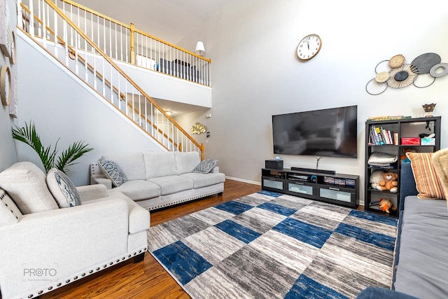 2012 Juniper Ct Unit 2012, Glendale Heights, IL 60139 - living room featuring stairs, wood finished floors, and a high ceiling