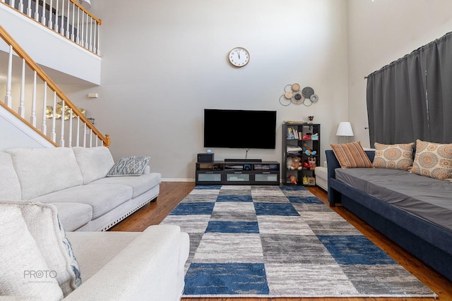 2012 Juniper Ct Unit 2012, Glendale Heights, IL 60139 - living room featuring a towering ceiling, wood finished floors, and stairway