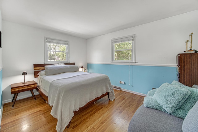 1306 Monroe St, Lake In The Hills, IL 60156 - bedroom featuring multiple windows and wood finished floors