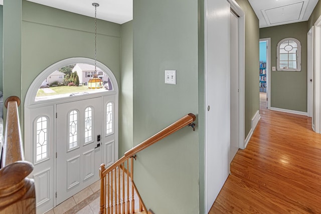 1306 Monroe St, Lake In The Hills, IL 60156 - entryway with a chandelier and light wood-style floors