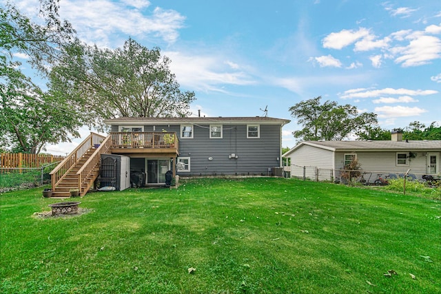 1306 Monroe St, Lake In The Hills, IL 60156 - back of house with an outdoor fire pit, stairway, a deck, and a fenced backyard