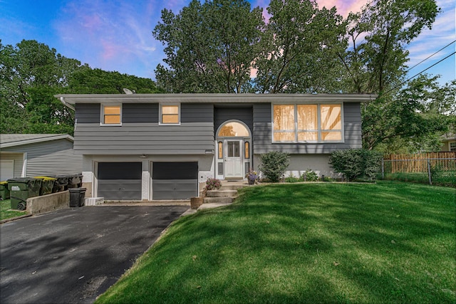1306 Monroe St, Lake In The Hills, IL 60156 - bi-level home featuring an attached garage and asphalt driveway