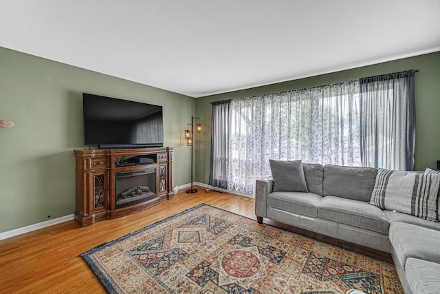 1306 Monroe St, Lake In The Hills, IL 60156 - living area with wood finished floors and a fireplace