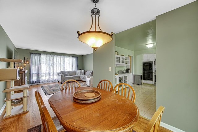 1306 Monroe St, Lake In The Hills, IL 60156 - dining room featuring wine cooler and light wood-type flooring