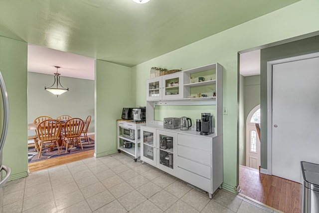 1306 Monroe St, Lake In The Hills, IL 60156 - bar area with light tile patterned floors and hanging light fixtures