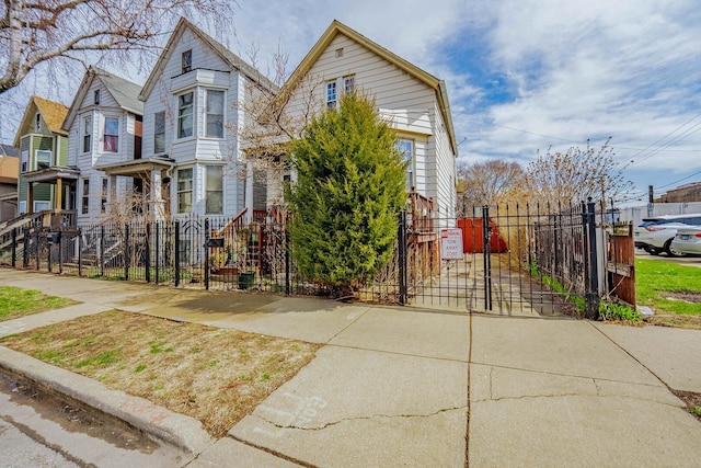 1621 N Central Park Ave, Chicago, IL 60647 - view of front of home with a gate, a fenced front yard, and a residential view