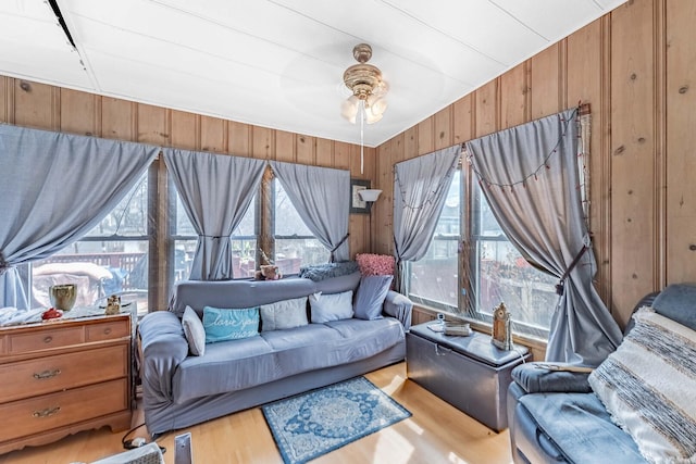 1621 N Central Park Ave, Chicago, IL 60647 - living room with wood finished floors, healthy amount of natural light, wooden walls, and a ceiling fan