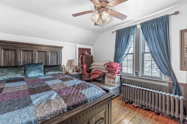 1621 N Central Park Ave, Chicago, IL 60647 - bedroom featuring radiator, vaulted ceiling, light wood-style flooring, and ceiling fan