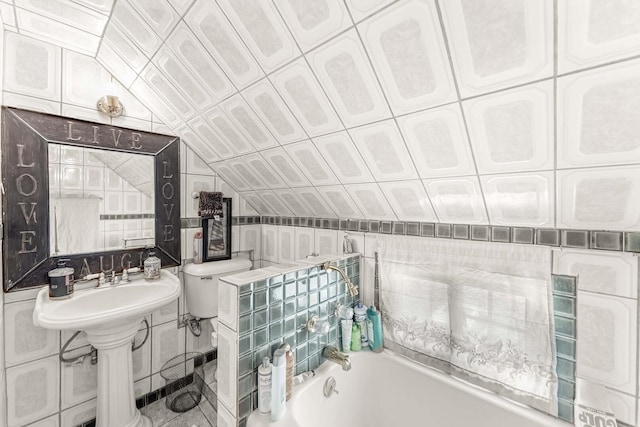1621 N Central Park Ave, Chicago, IL 60647 - full bathroom with a garden tub, tile walls, and lofted ceiling