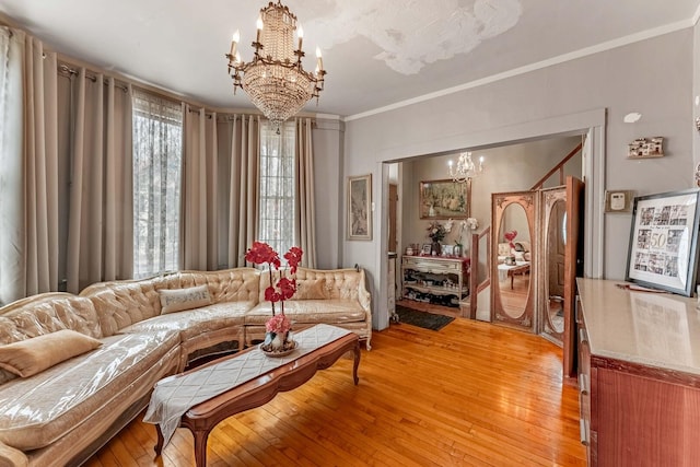 1621 N Central Park Ave, Chicago, IL 60647 - living room with a chandelier, ornamental molding, and light wood-style flooring