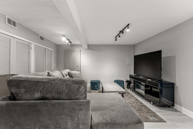 1621 N Central Park Ave, Chicago, IL 60647 - living room featuring track lighting and baseboards