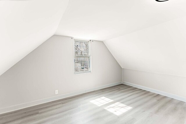 1621 N Central Park Ave, Chicago, IL 60647 - additional living space with vaulted ceiling and wood finished floors