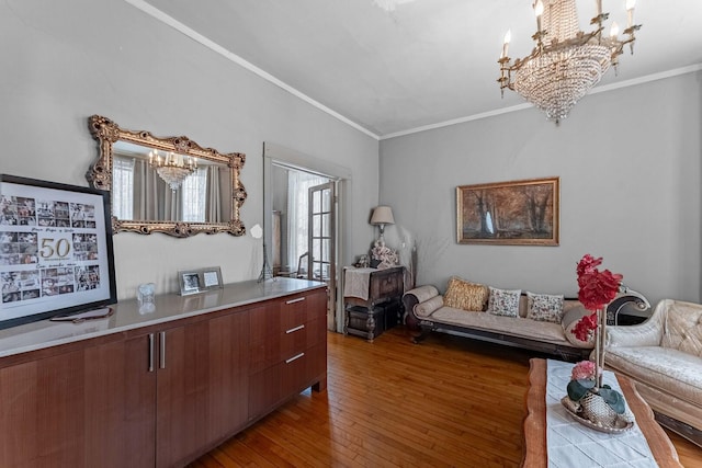1621 N Central Park Ave, Chicago, IL 60647 - living room with a chandelier, crown molding, and hardwood / wood-style floors