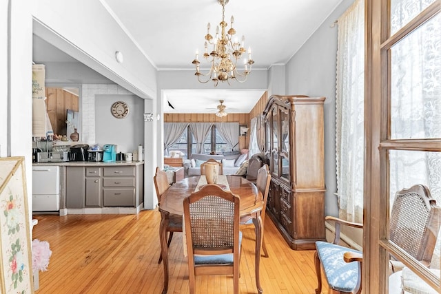 1621 N Central Park Ave, Chicago, IL 60647 - dining area featuring light wood-type flooring, a chandelier, a ceiling fan, and crown molding