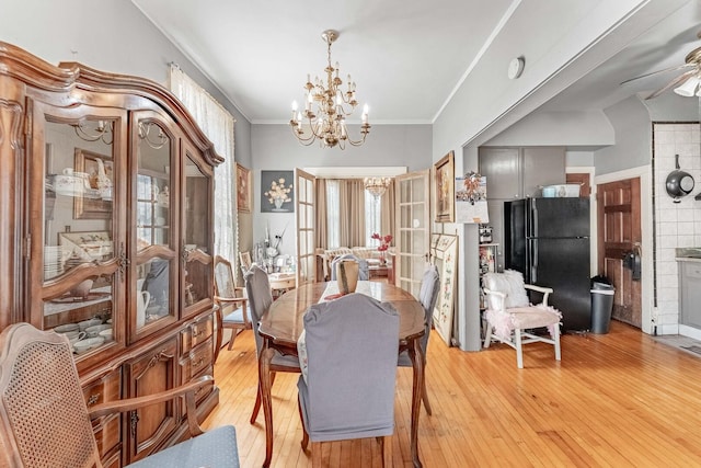 1621 N Central Park Ave, Chicago, IL 60647 - dining space featuring a chandelier, light wood-type flooring, ornamental molding, and ceiling fan