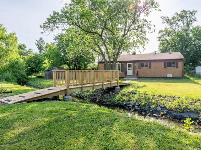 15117 La Crosse Ave, Oak Forest, IL 60452 - view of grassy yard featuring a storage shed and a wooden deck