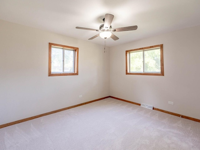 15117 La Crosse Ave, Oak Forest, IL 60452 - spare room featuring light carpet and ceiling fan