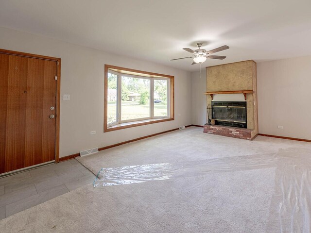 15117 La Crosse Ave, Oak Forest, IL 60452 - unfurnished living room with ceiling fan, a fireplace, and light colored carpet