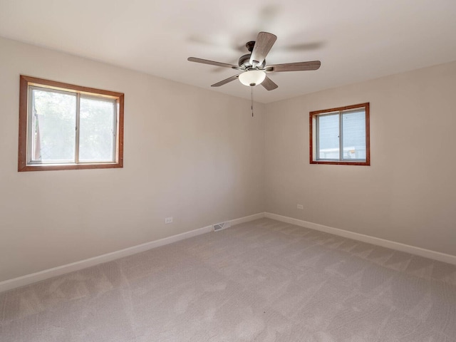 15117 La Crosse Ave, Oak Forest, IL 60452 - empty room featuring plenty of natural light, light colored carpet, and ceiling fan