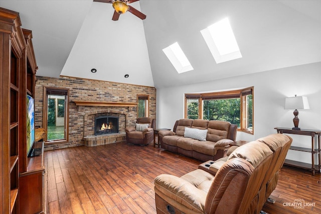 23 Colony Ct, Yorkville, IL 60560 - living area featuring a skylight, high vaulted ceiling, a brick fireplace, wood-type flooring, and ceiling fan