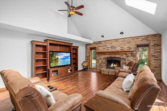 23 Colony Ct, Yorkville, IL 60560 - living area featuring high vaulted ceiling, hardwood / wood-style floors, ceiling fan, a fireplace, and a skylight