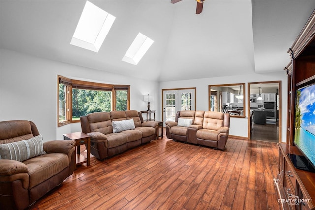 23 Colony Ct, Yorkville, IL 60560 - living room featuring high vaulted ceiling, a skylight, dark wood finished floors, healthy amount of natural light, and ceiling fan