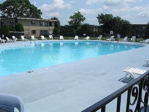 38 King Arthur Ct Unit 14, Northlake, IL 60164 - community pool featuring a patio