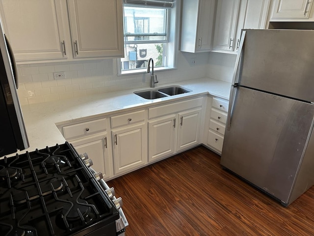 38 King Arthur Ct Unit 14, Northlake, IL 60164 - kitchen featuring freestanding refrigerator, gas range, white cabinetry, and light countertops