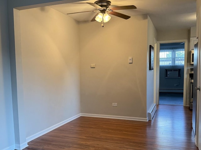 38 King Arthur Ct Unit 14, Northlake, IL 60164 - spare room featuring baseboard heating, dark wood-type flooring, a baseboard heating unit, ceiling fan, and a wall mounted AC