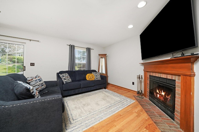 1484 Joshel Ct, Geneva, IL 60134 - living room featuring plenty of natural light, wood finished floors, a fireplace, recessed lighting, and lofted ceiling