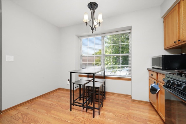 1484 Joshel Ct, Geneva, IL 60134 - dining room featuring healthy amount of natural light, light wood-type flooring, and a chandelier