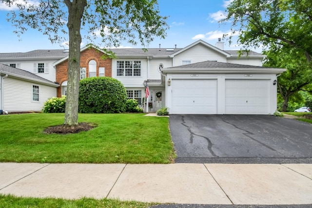 27W415 Providence Ln Unit 103, Winfield, IL 60190 - traditional-style home featuring a garage, asphalt driveway, a front lawn, and brick siding