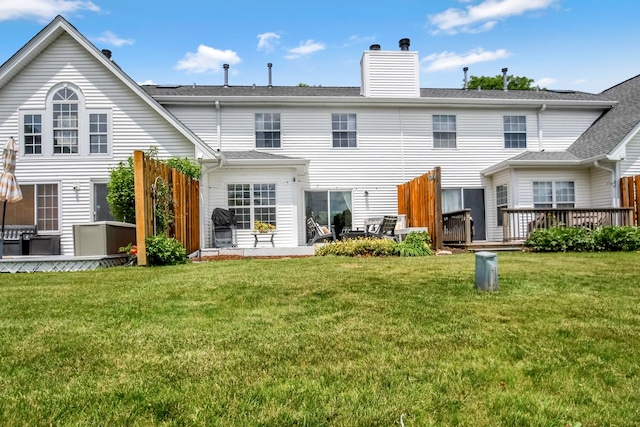 27W415 Providence Ln Unit 103, Winfield, IL 60190 - rear view of house featuring a lawn, a wooden deck, and a chimney