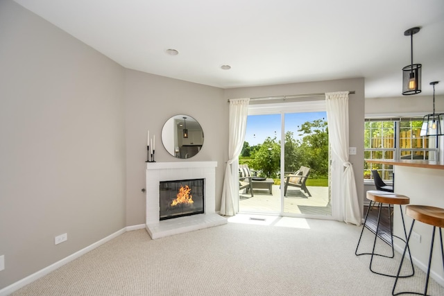 27W415 Providence Ln Unit 103, Winfield, IL 60190 - living room featuring carpet floors and a glass covered fireplace