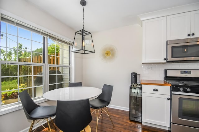 27W415 Providence Ln Unit 103, Winfield, IL 60190 - dining space with baseboards and dark wood-style flooring
