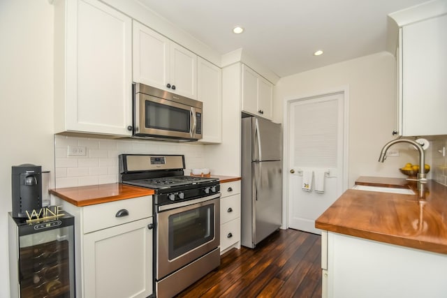 27W415 Providence Ln Unit 103, Winfield, IL 60190 - kitchen featuring appliances with stainless steel finishes, wood counters, wine cooler, dark wood-type flooring, and recessed lighting