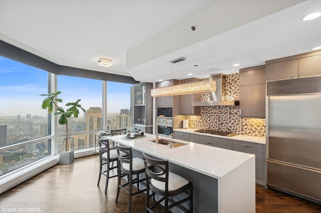 401 N Wabash Ave Unit 44F, Chicago, IL 60611 - kitchen featuring stainless steel appliances, gray cabinets, wall chimney exhaust hood, plenty of natural light, and recessed lighting