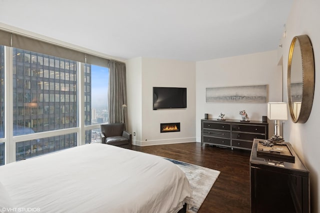 401 N Wabash Ave Unit 44F, Chicago, IL 60611 - bedroom featuring wood finished floors and a warm lit fireplace