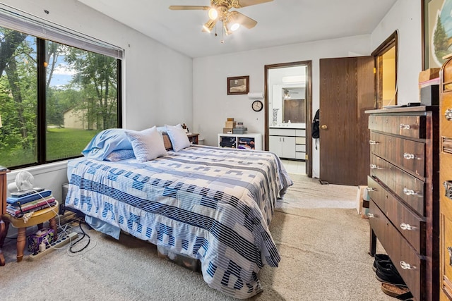 770 Yosemite Trl, Roselle, IL 60172 - bedroom with light colored carpet, connected bathroom, and ceiling fan