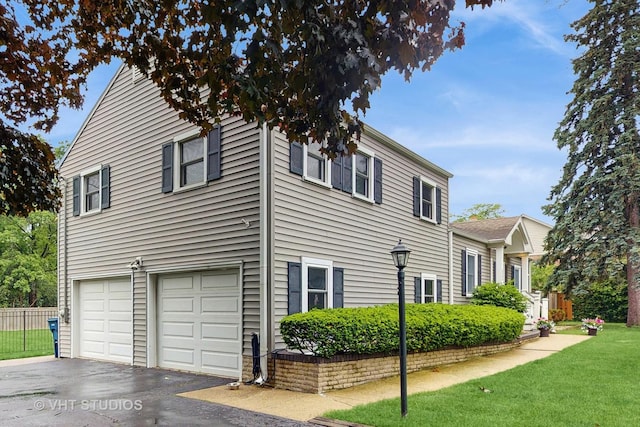 2333 Catherine St, Northbrook, IL 60062 - view of side of property with a garage and asphalt driveway