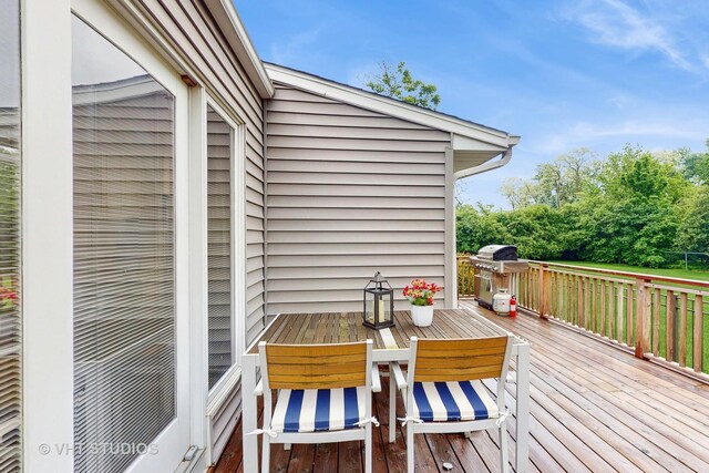 2333 Catherine St, Northbrook, IL 60062 - wooden deck featuring grilling area and outdoor dining area