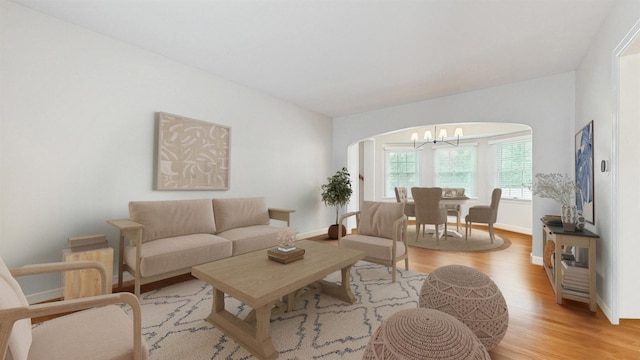 2333 Catherine St, Northbrook, IL 60062 - living area featuring a chandelier, light wood-style flooring, and arched walkways