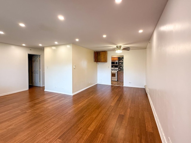 1840 W Hatherleigh Ct Unit 1E, Mount Prospect, IL 60056 - unfurnished living room featuring ceiling fan, recessed lighting, and dark wood-type flooring