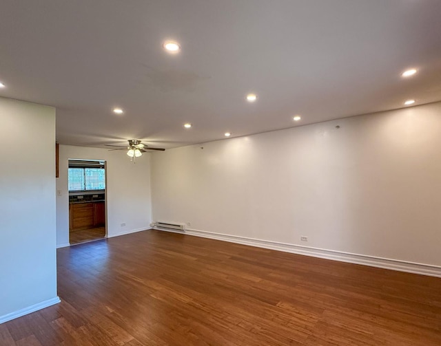 1840 W Hatherleigh Ct Unit 1E, Mount Prospect, IL 60056 - unfurnished room featuring baseboard heating, dark wood-type flooring, recessed lighting, and a ceiling fan