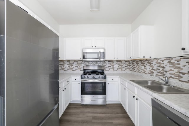 3317 Stratford Ct Unit 2E, Lake Bluff, IL 60044 - kitchen with stainless steel appliances, dark wood-type flooring, light countertops, white cabinetry, and tasteful backsplash
