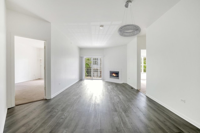 3317 Stratford Ct Unit 2E, Lake Bluff, IL 60044 - unfurnished living room featuring dark wood-style flooring and a glass covered fireplace