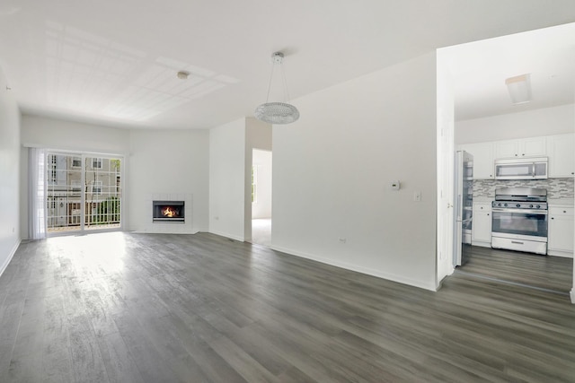 3317 Stratford Ct Unit 2E, Lake Bluff, IL 60044 - unfurnished living room with dark wood finished floors and a glass covered fireplace