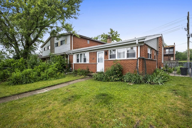 535 Glenshire Rd, Glenview, IL 60025 - view of front facade with brick siding and a chimney