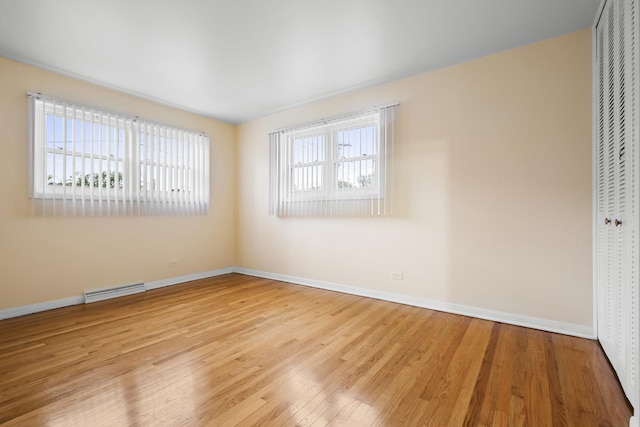 535 Glenshire Rd, Glenview, IL 60025 - unfurnished bedroom featuring a closet and wood finished floors